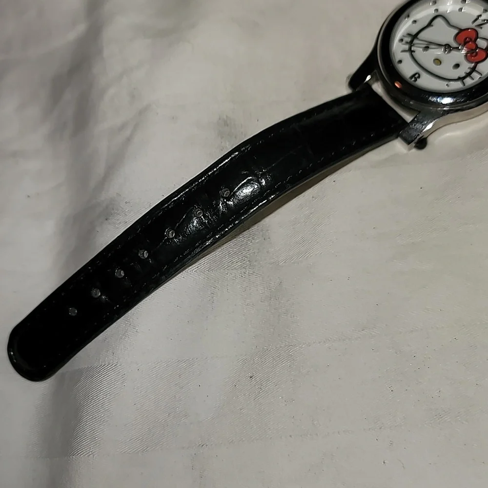 NWOT Sanrio Hello Kitty Womens Charm Quartz Watch Black Leather Band Silver Case